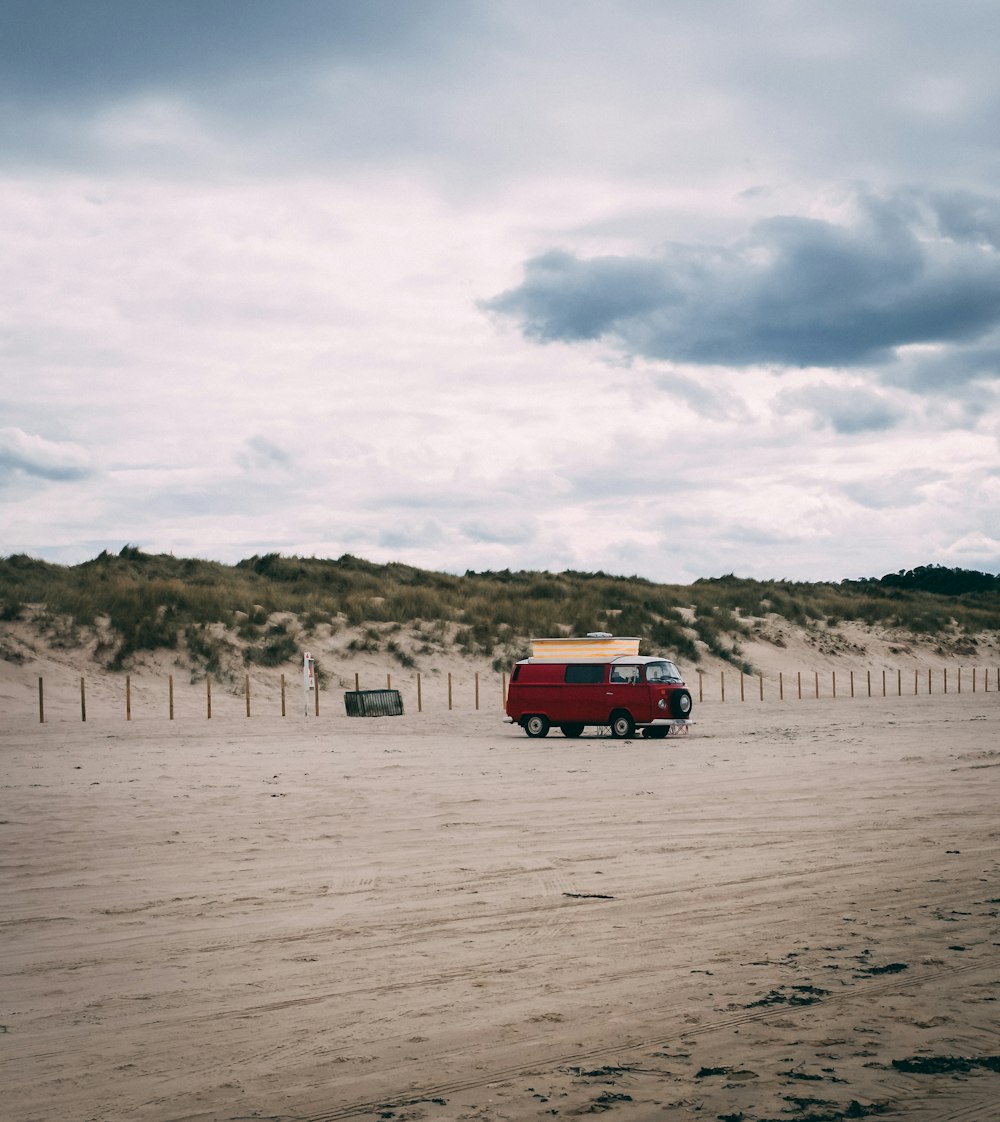 red van on road near mountain