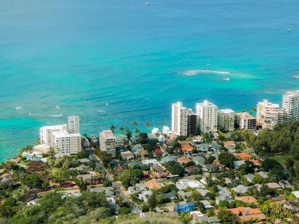 aerial view of buildings and houses by the sea