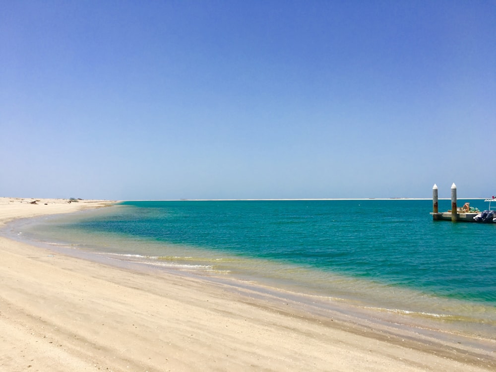 blue beach under blue sky