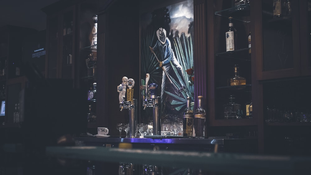 a bar with liquor bottles and liquor glasses