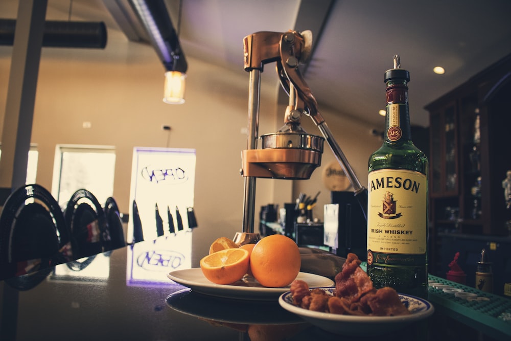 Download Green Jagermeister Glass Bottle Beside Orange Fruit Photo Free Alcohol Image On Unsplash PSD Mockup Templates