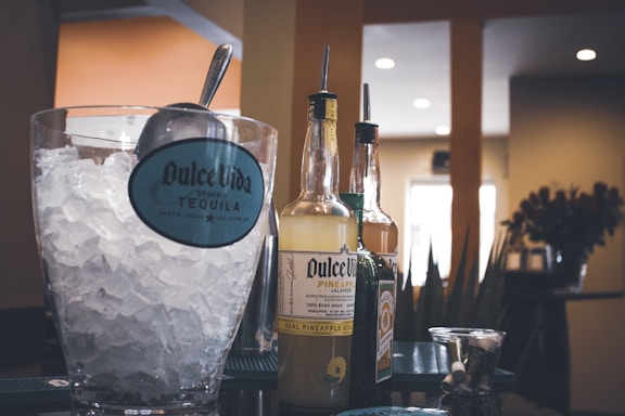 Photo of a chilled bag of ice rolls with the Hielos Larico logo on a wooden counter.