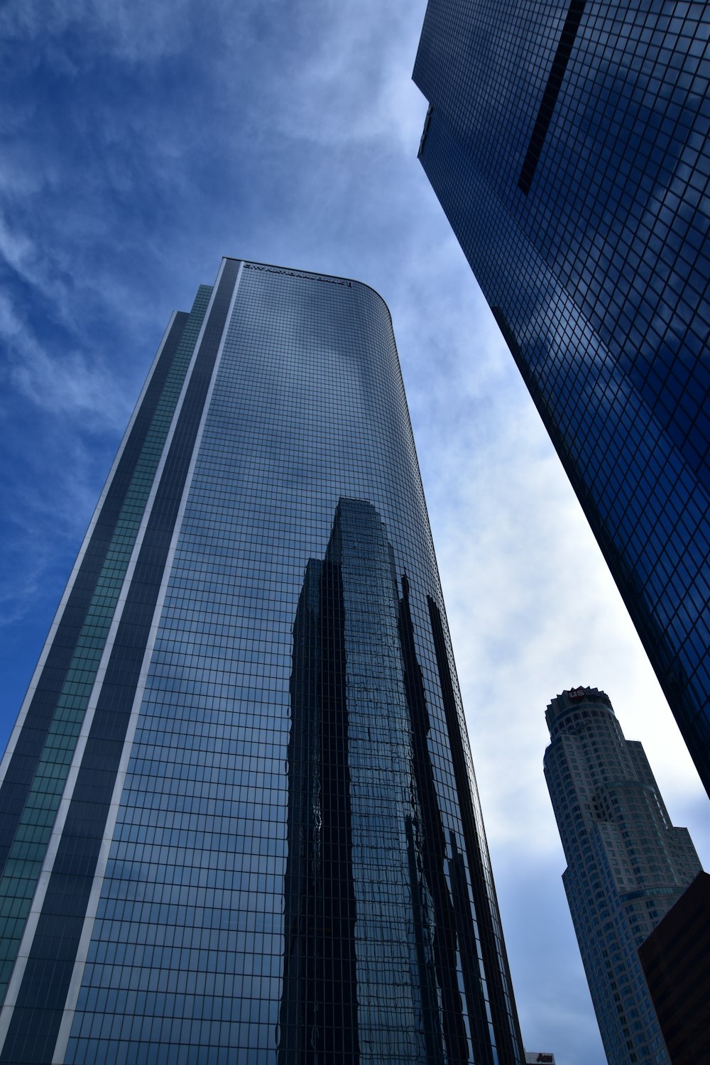 low angle photo of curtain glass wall building