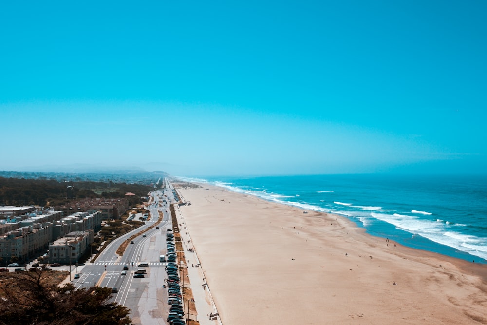 a view of the beach from the top of a hill