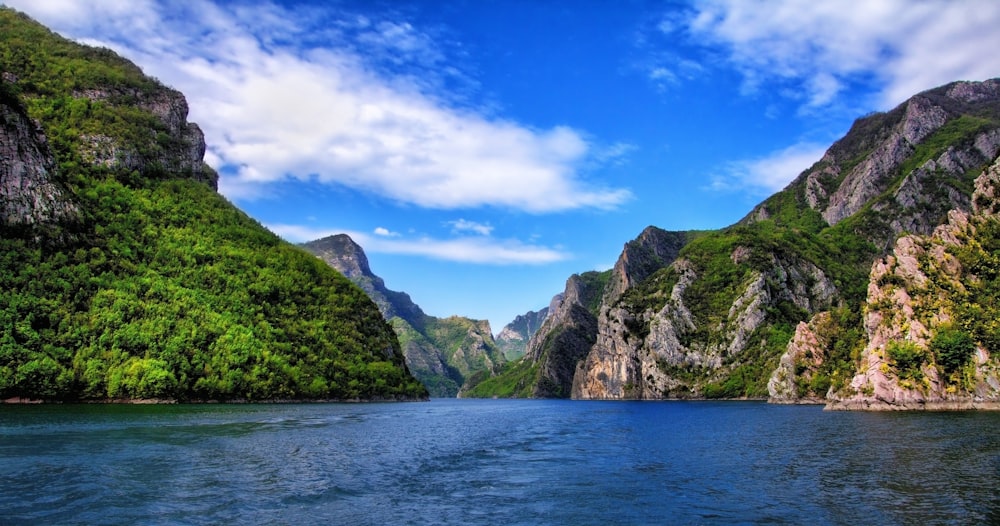 mountains near body of water