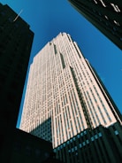 Commercial building framework rising against a clear sky.