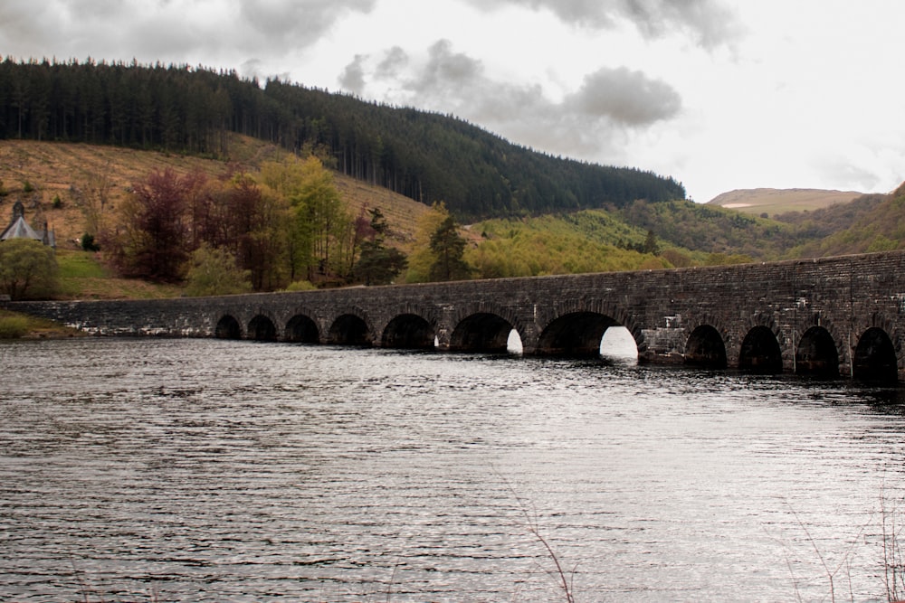 concrete bridge near mountain