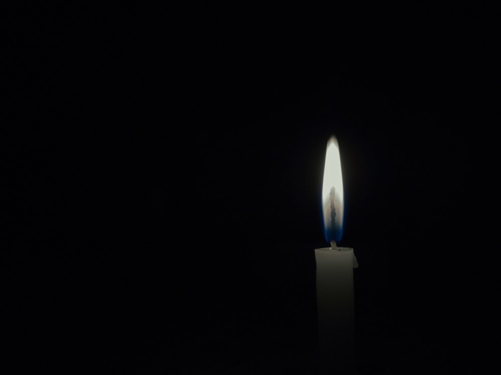 selective focus photo of lighted candle