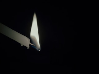 A candle lit in remembrance and hope.