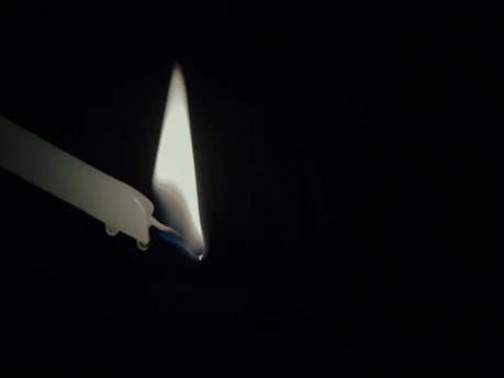 A serene candle burning softly in a quiet chapel.