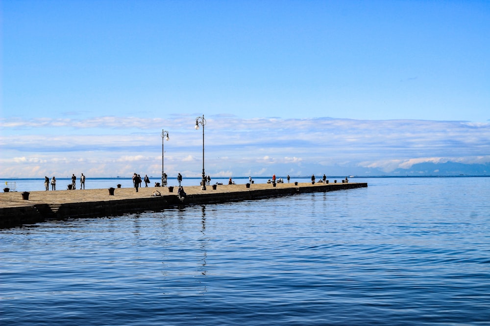 dock in beach during daytime