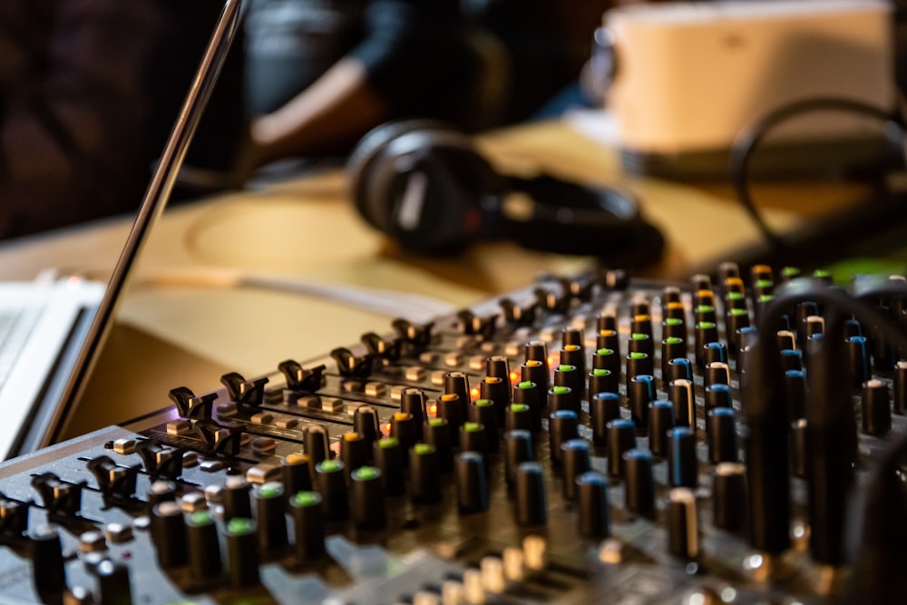 person near headphones and mixer