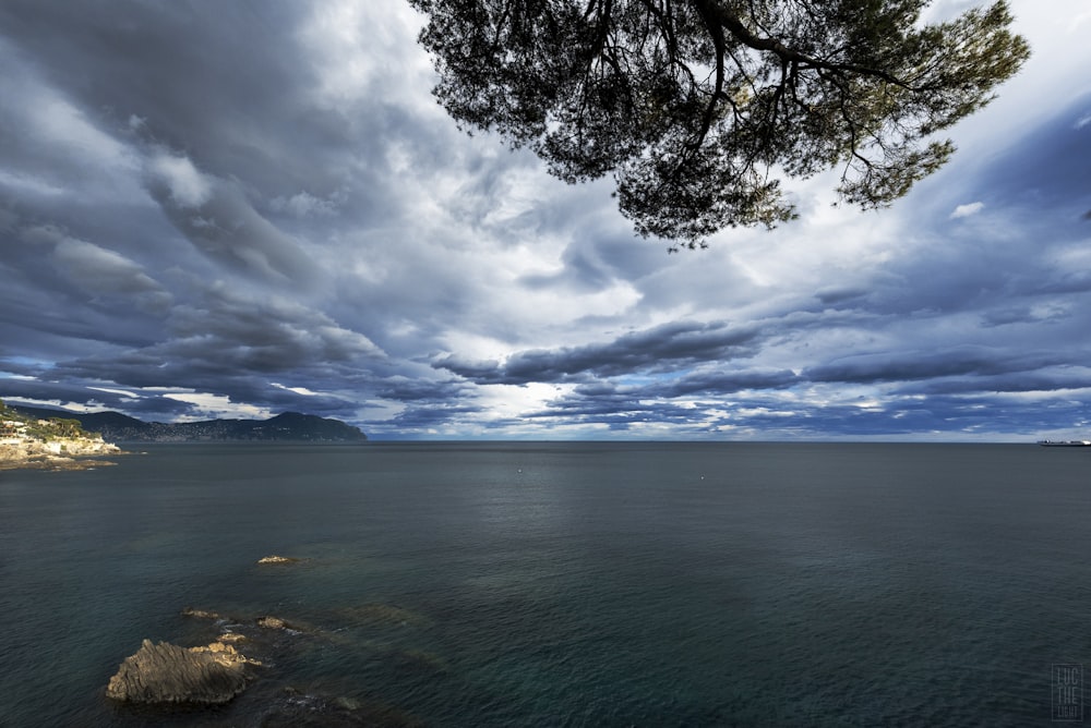 grey and blue cloudy sky over the sea
