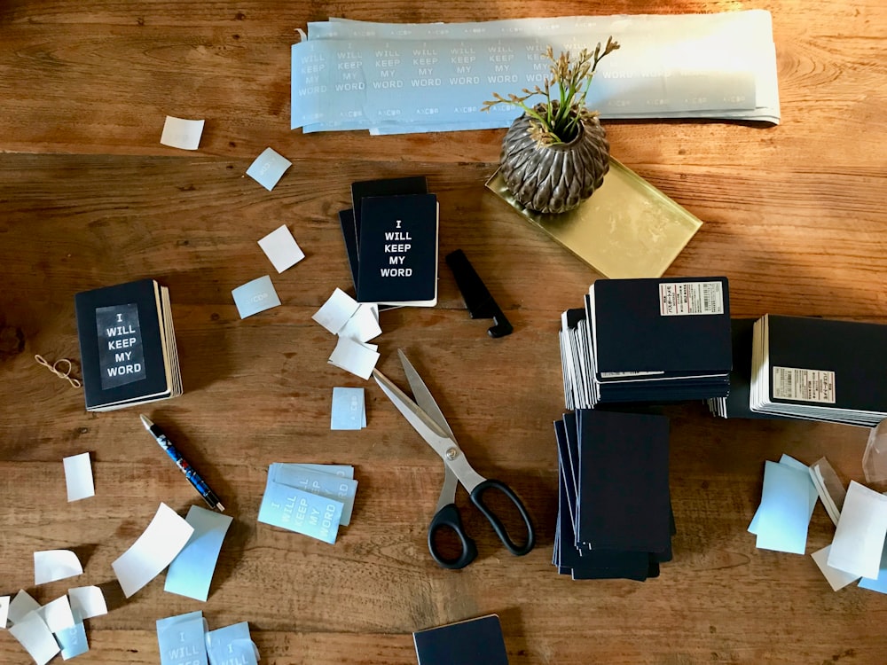 books, papers, and items on brown surface