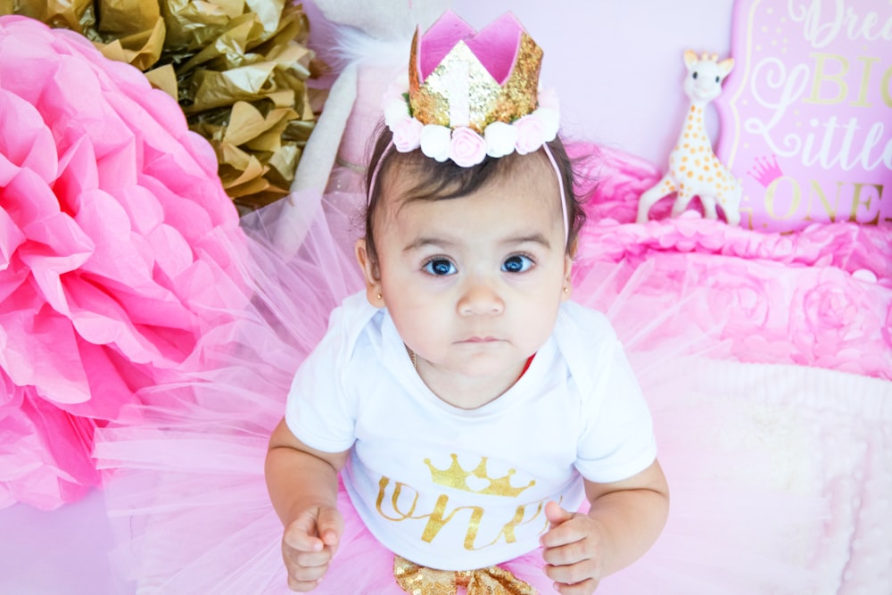 toddler wearing white onesie