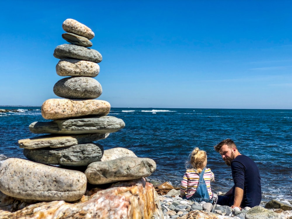 man and girl on beach