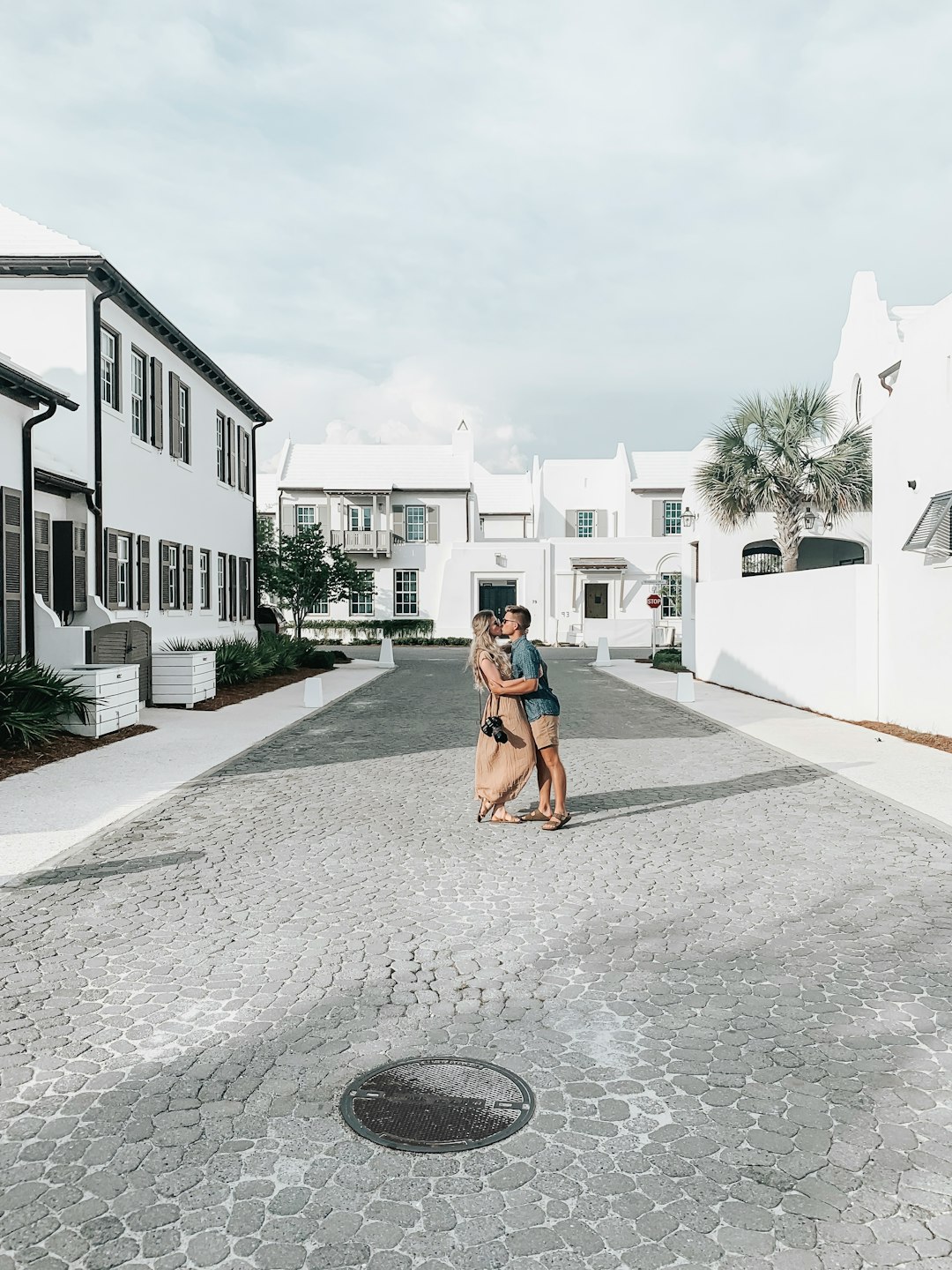 couple kissing at the middle of the street