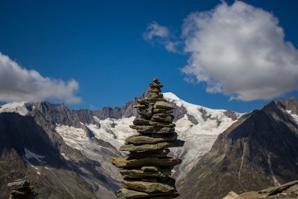 stocked stones beside mountain in nature photography