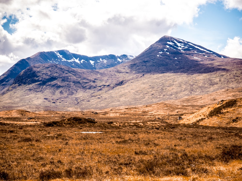 grey and white clouds hovering above mountain