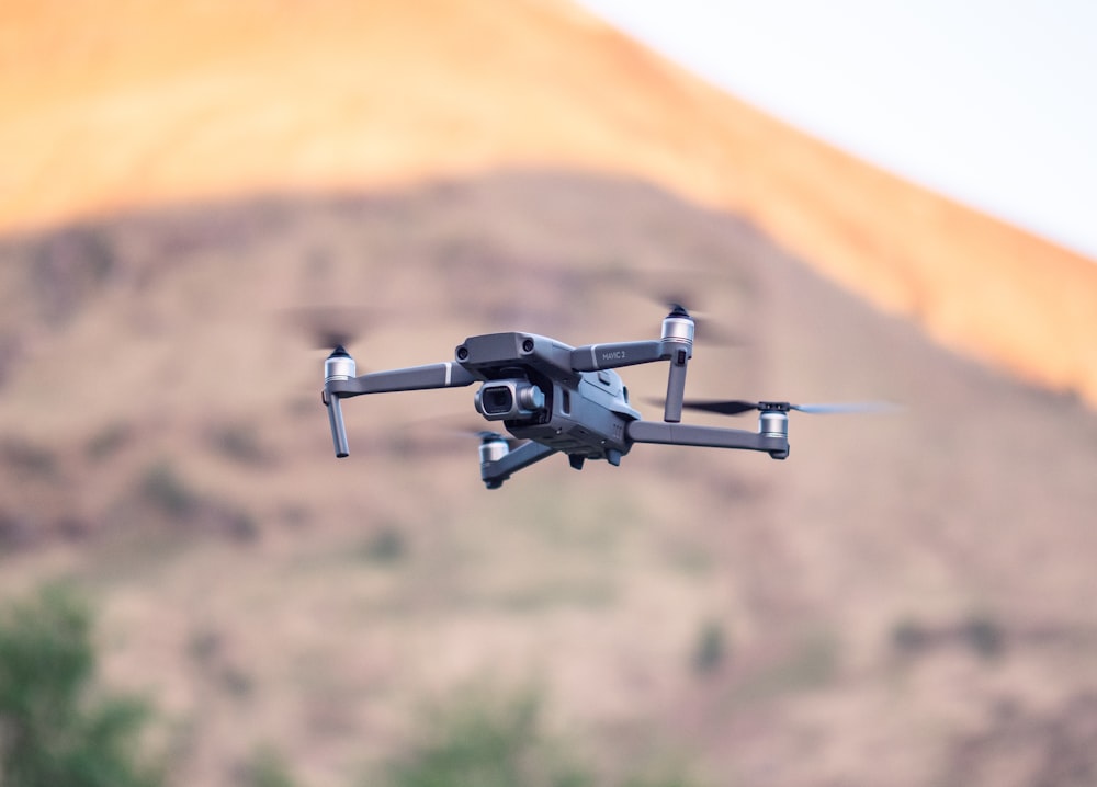 black and gray quadcopter drone