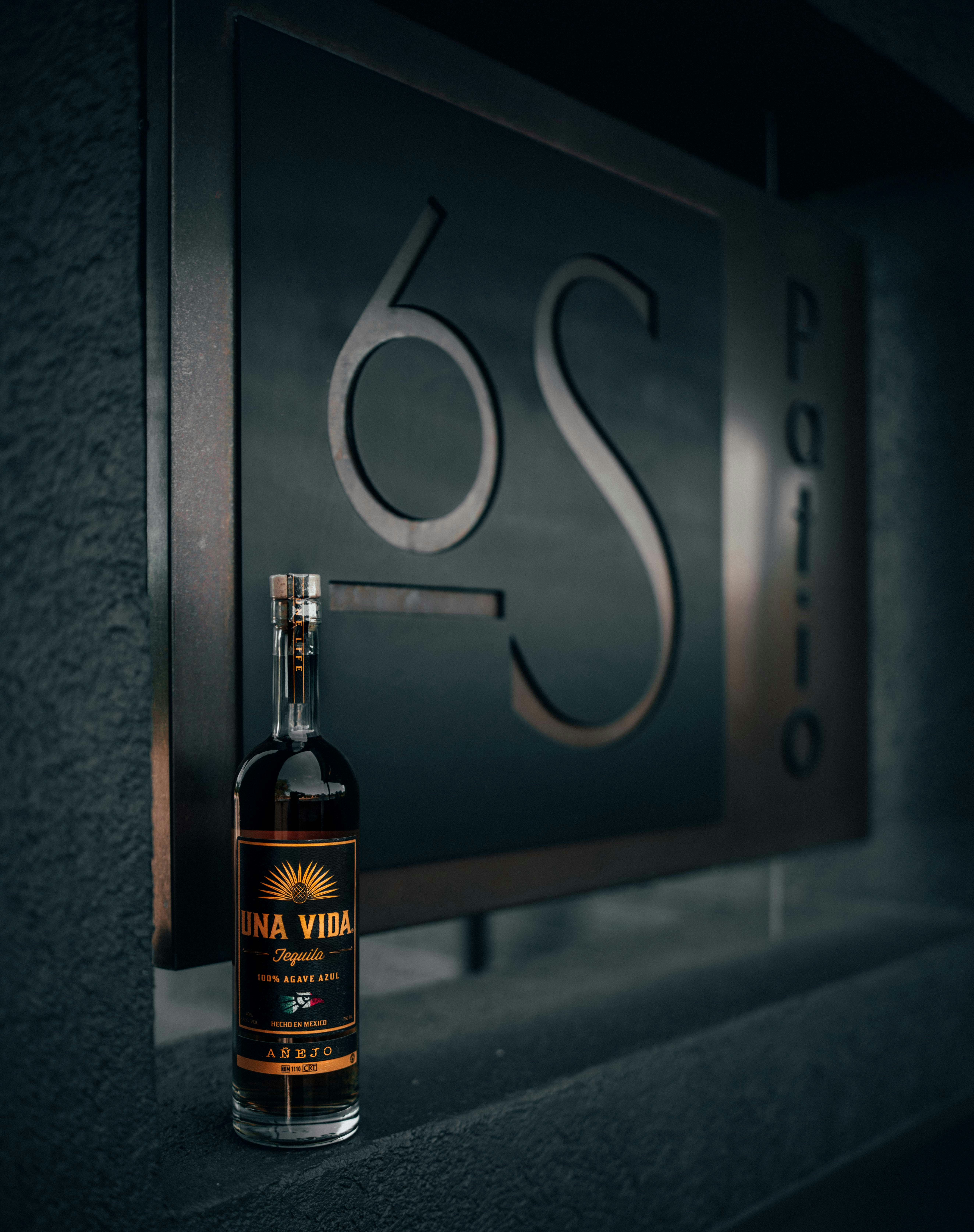 labeled bottle near signage