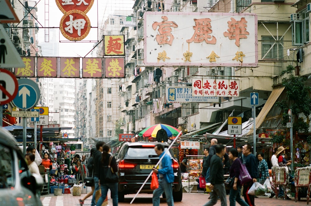 people walking in road during daytime