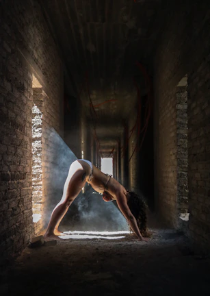 A serene yoga pose performed in a softly lit room.