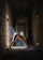 A serene yoga studio with soft natural light highlighting a student in a gentle knee-friendly pose.
