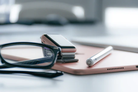A close-up of a stylish smart gadget on a minimalist desk with soft natural lighting.