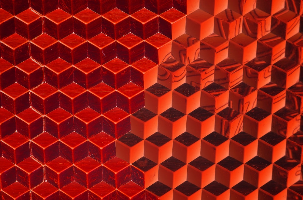 a close up of a wall made of red glass blocks