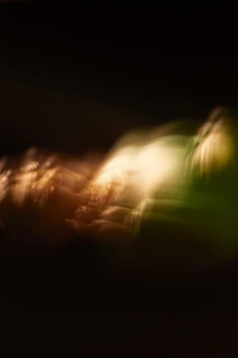 Warm-toned photo of energy flow visualization with subtle light effects around a person.