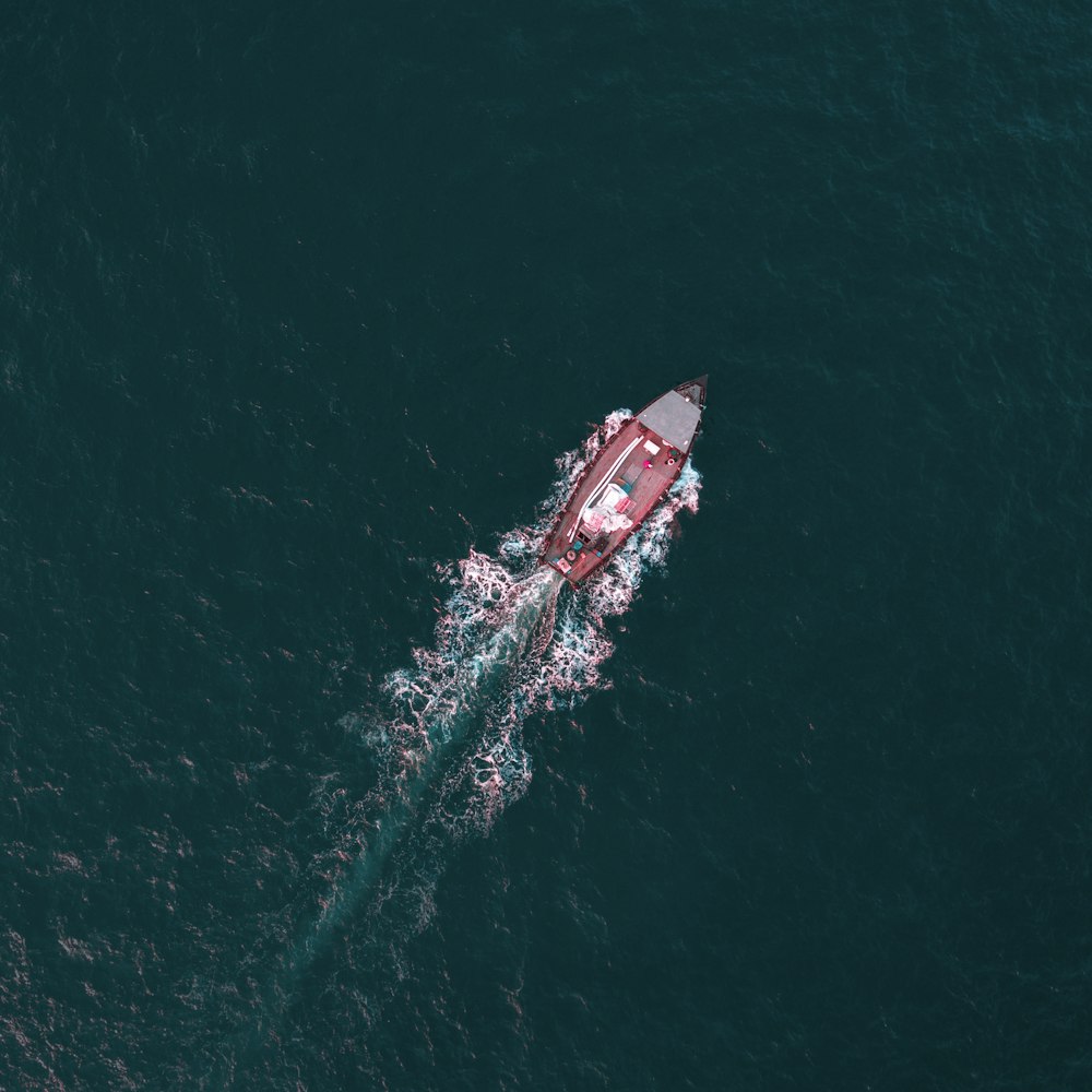 aerial view of boat on calm body of water