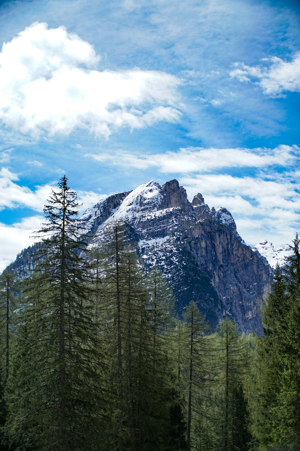 snow-covered mountain under blue sky