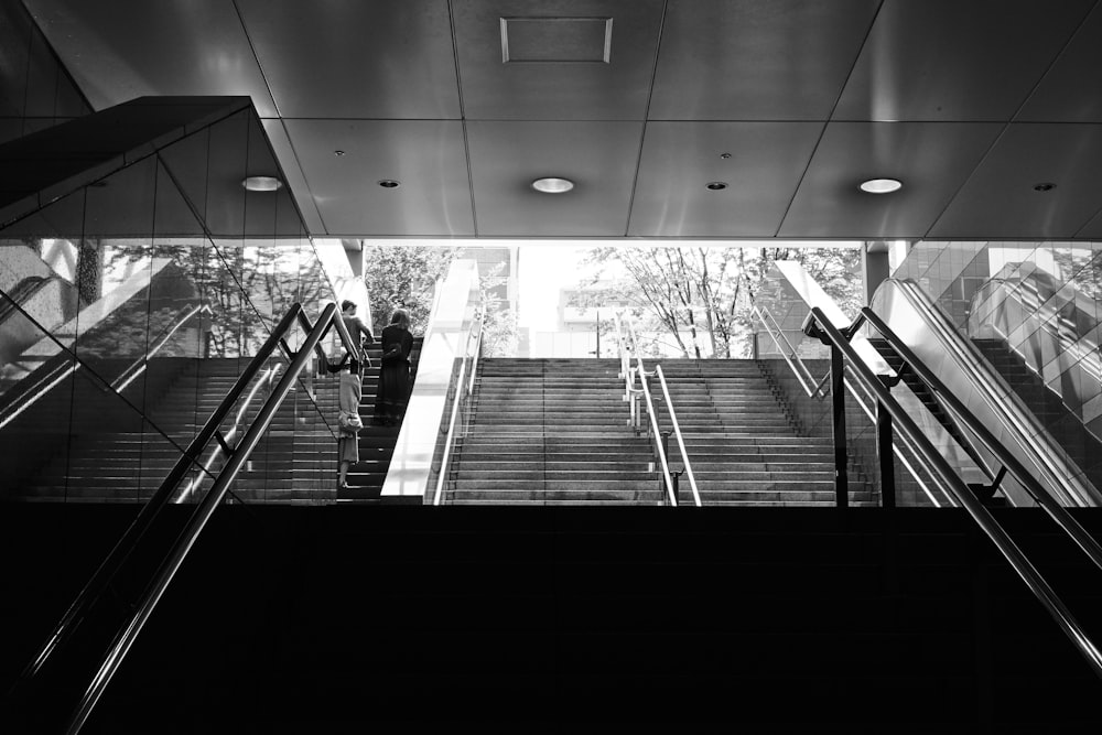 grayscale photo of subway stairs
