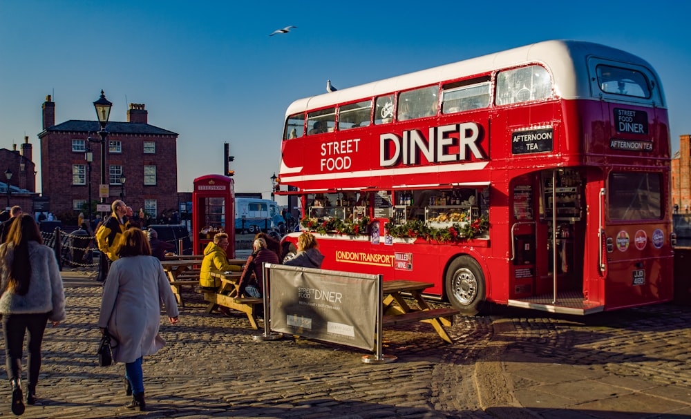 red double deck bus Diner street food park near buildings