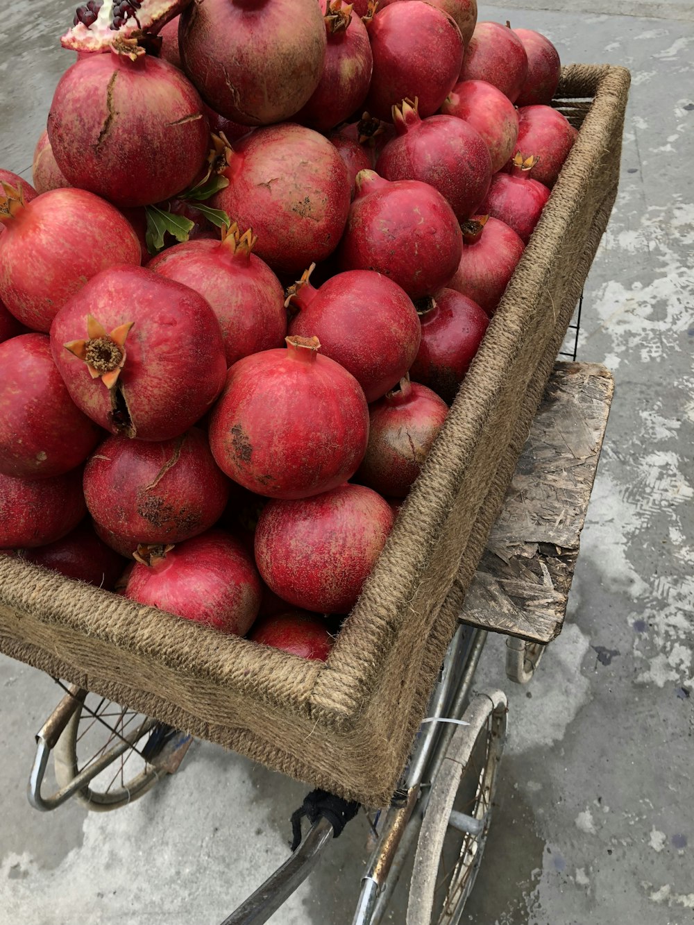 red radishes in brown wheelbarrow