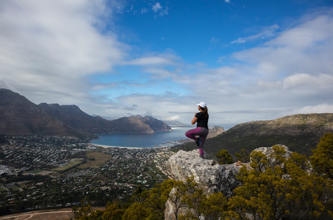 woman standing on cliff