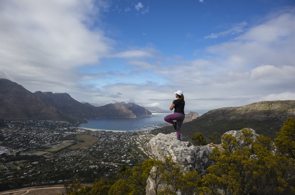 woman standing on cliff