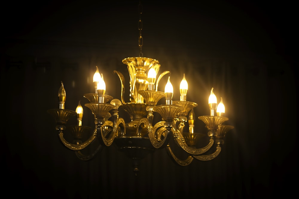 brass-colored uplight chandelier turned-on