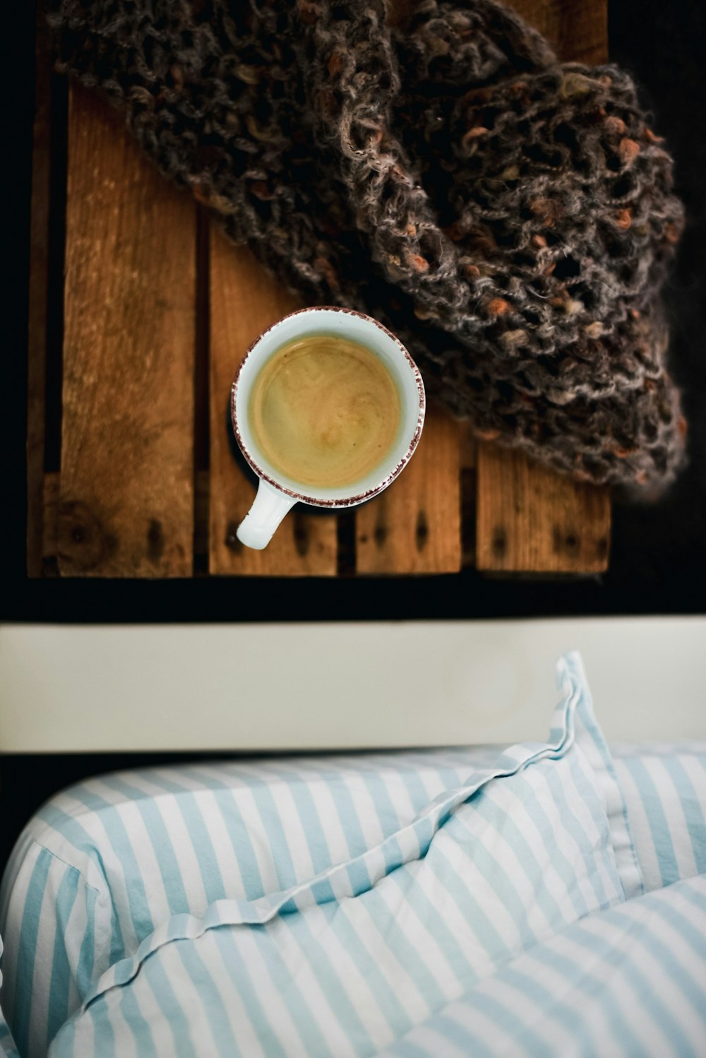 liquid filled cup beside scarf