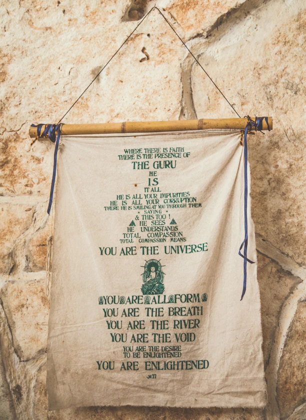 white and green scroll poster about meditation and spirituality