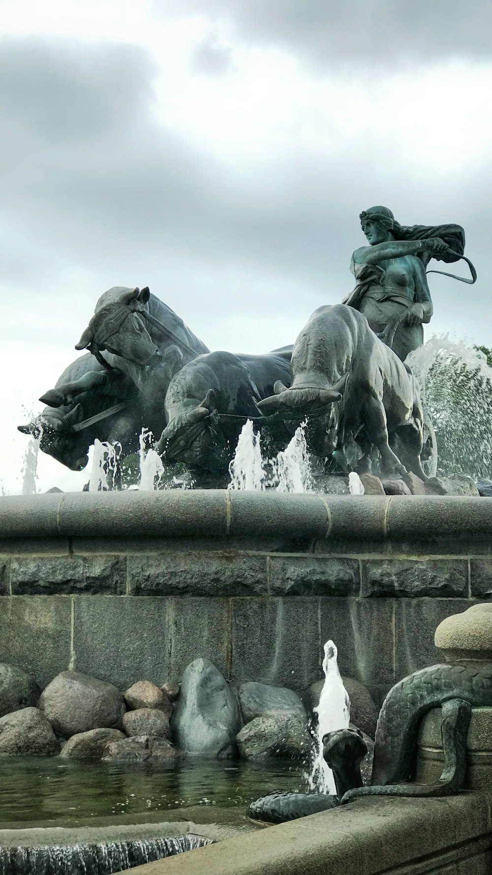 man riding bull statue