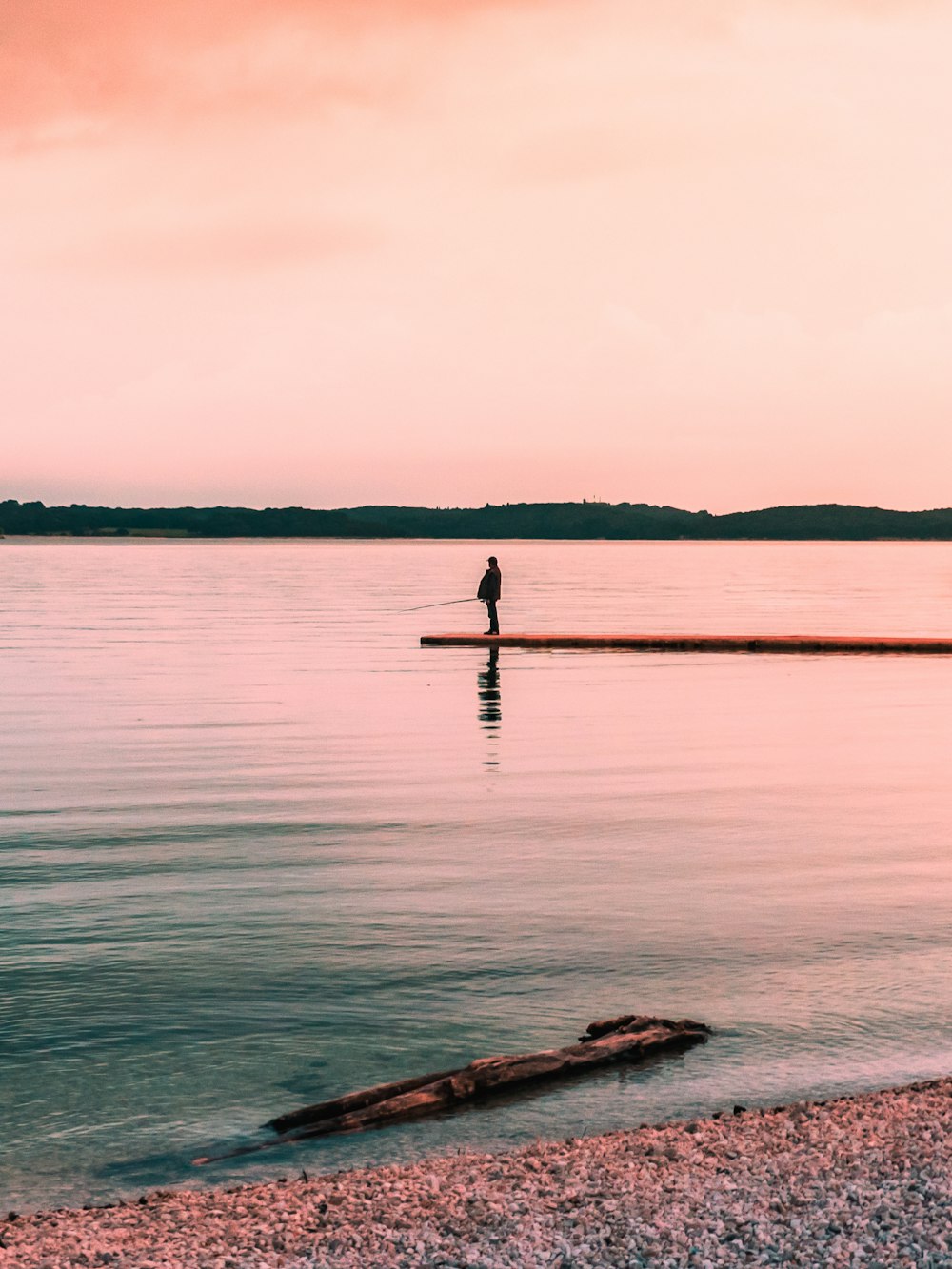 person standing on dock