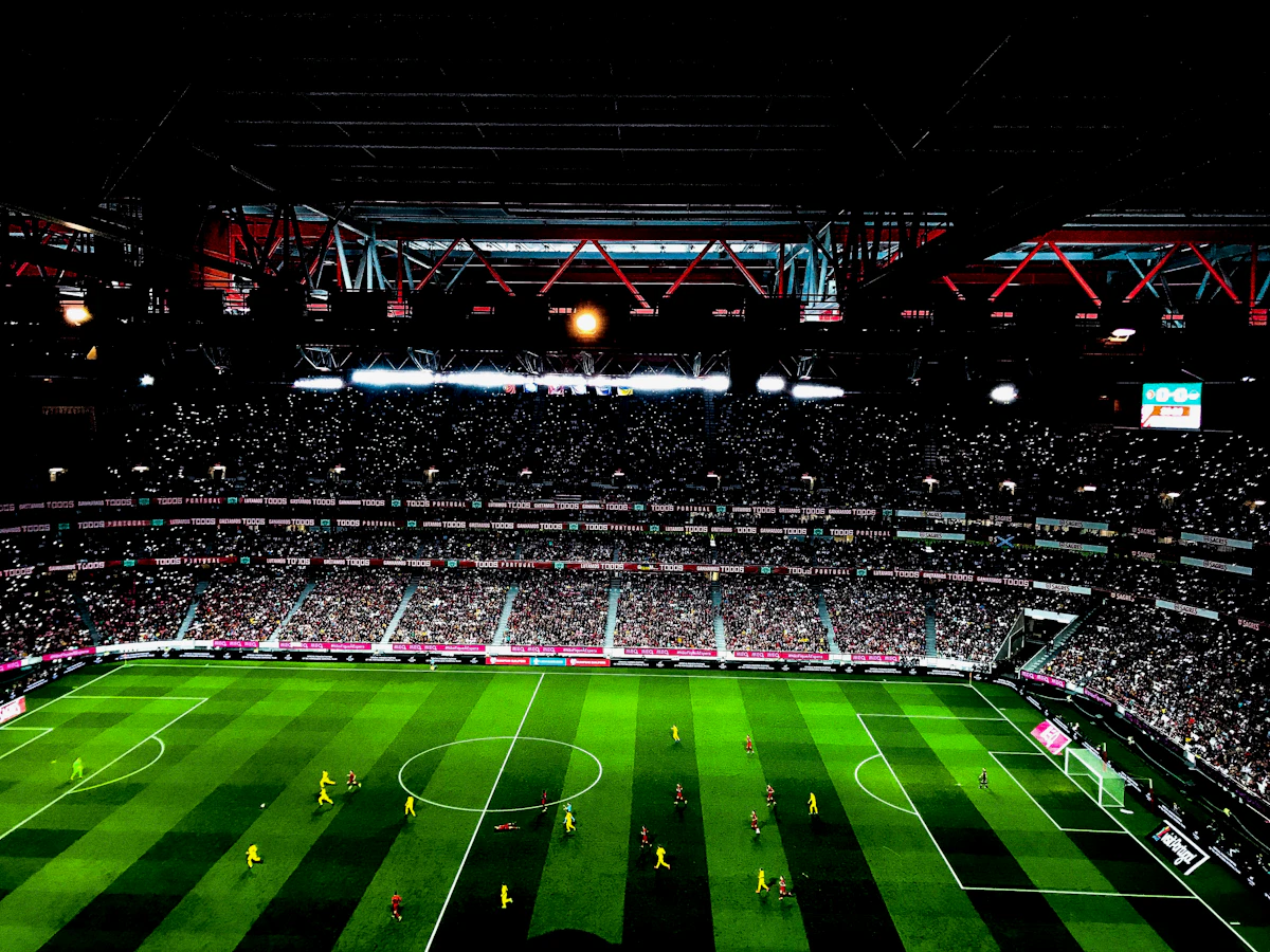 Football match underway in a packed stadium in Portugal