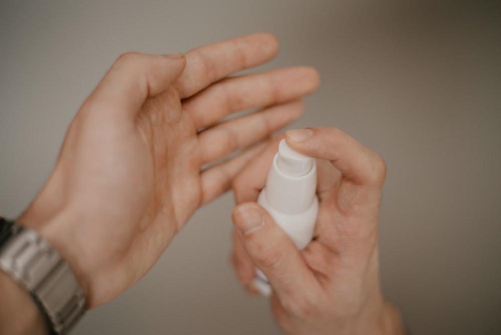 person holding bottle