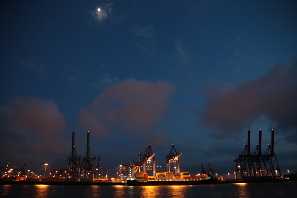 buildings near ocean during nighttime