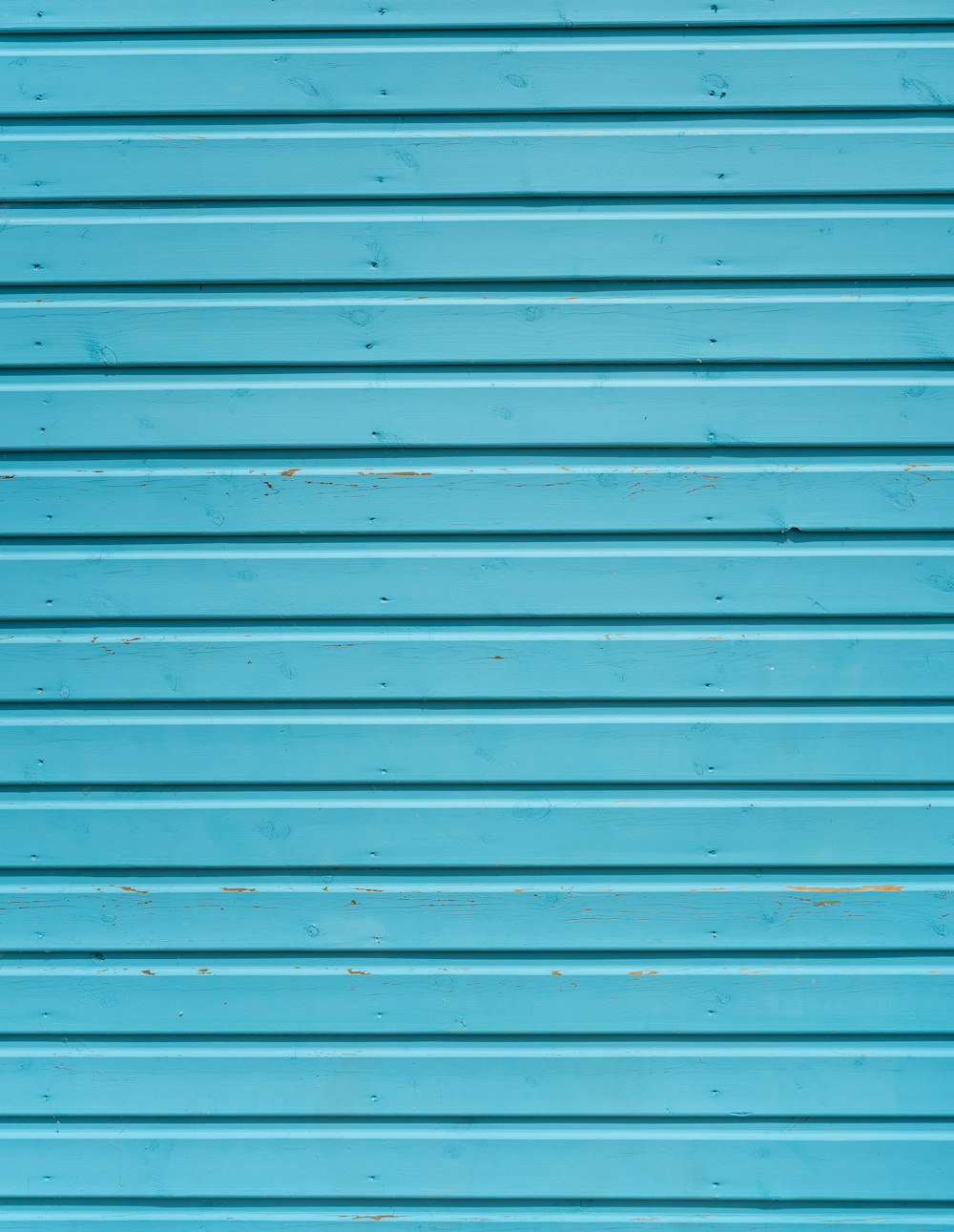 Foto de primer plano de la puerta del obturador verde azulado