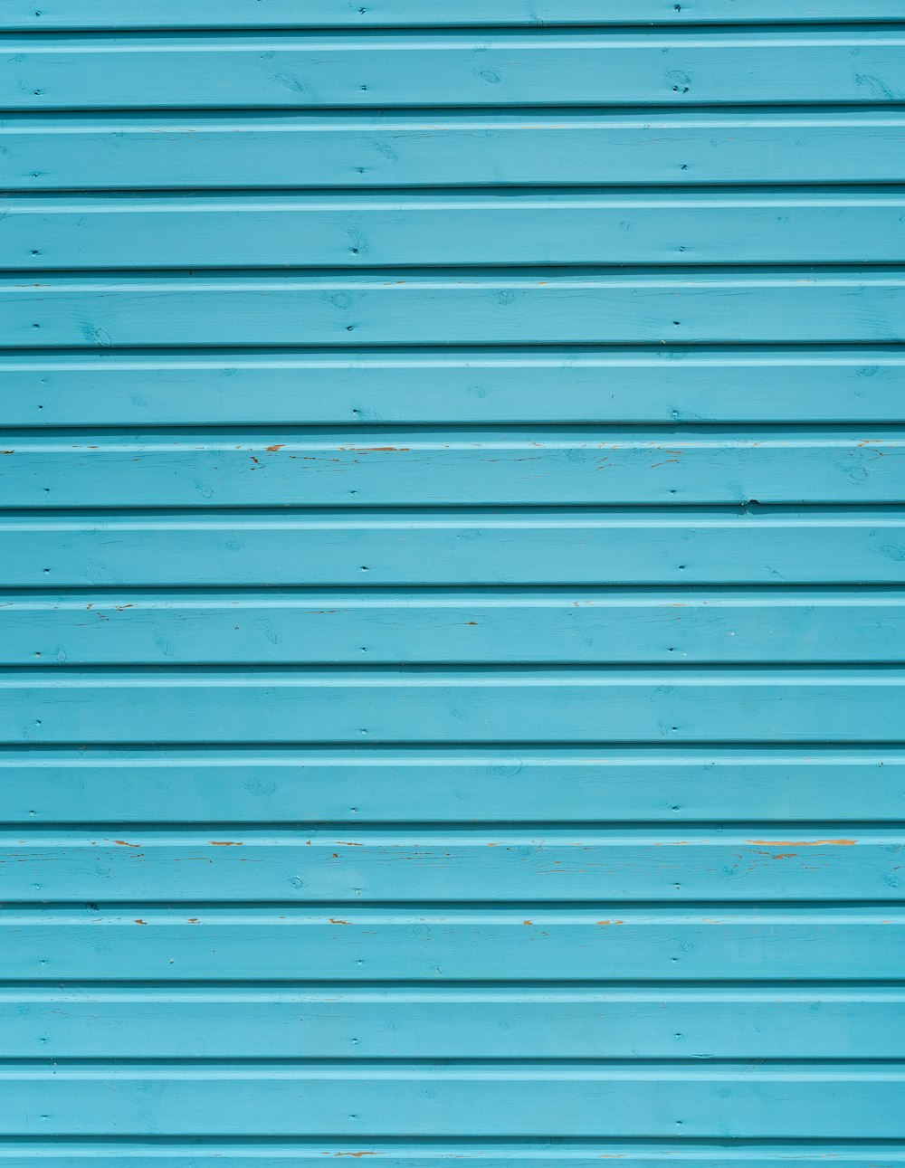 close up photo of teal shutter door