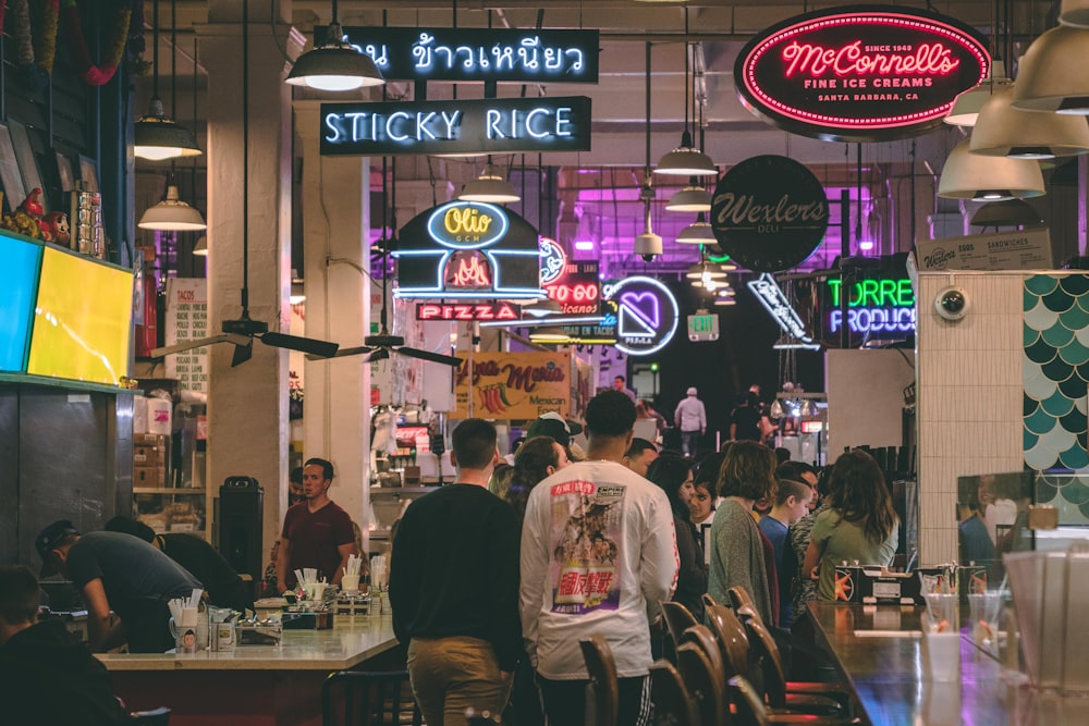 people walking beside table