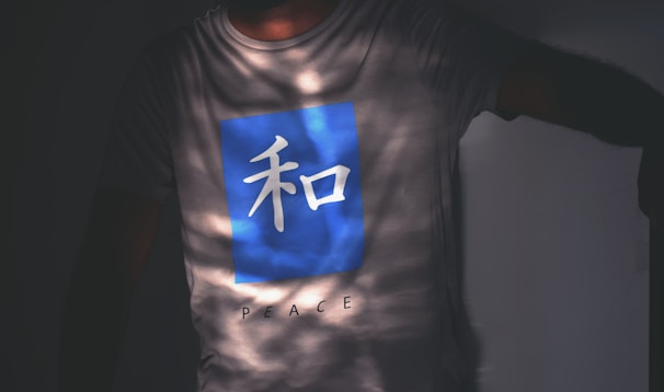 A minimalist clothing design showcasing symbols of peace.